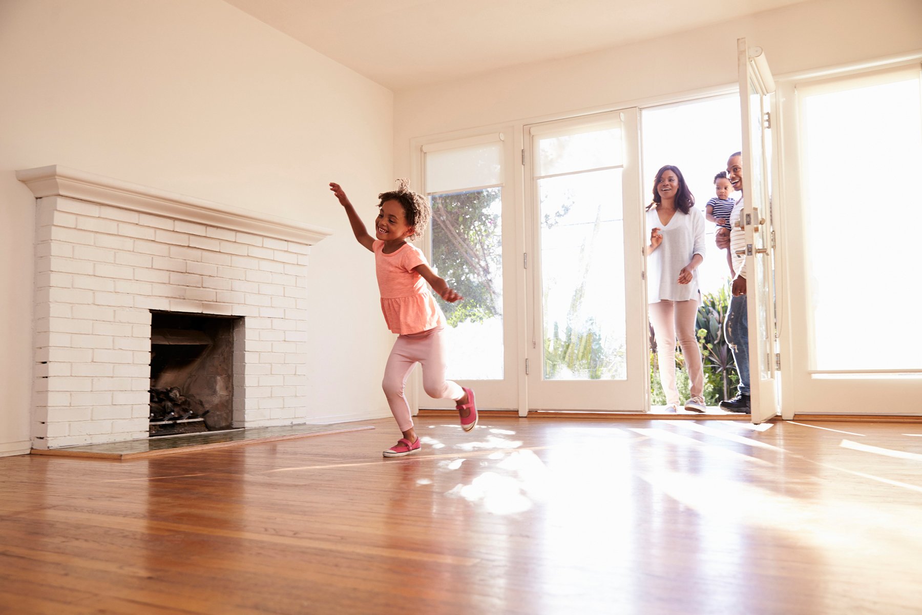 Family walking into their new home after completing the homebuying process