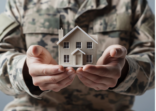 Veteran holding a toy wood house