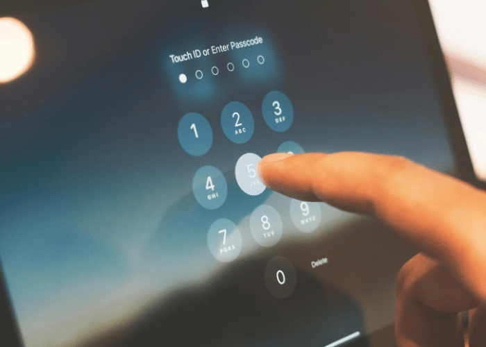 Closeup of person entering passcode.