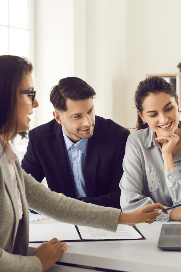 couple-at-desk-with-woman-vertical