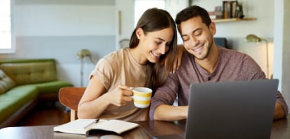 couple-home-looking-at-iras-laptop