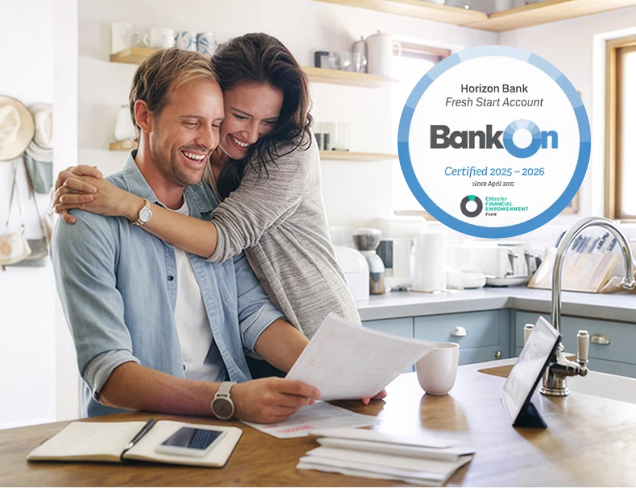 happy-couple-hug-with-documents-bankon