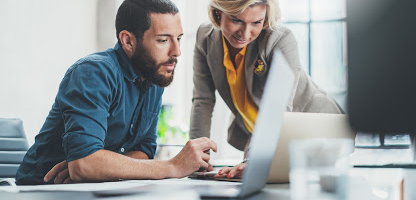 man-woman-looking-at-laptop-home-equity